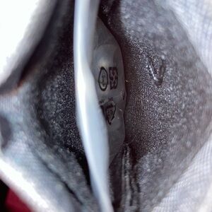 Jbl mini headphone ear bud bag with earbuds inside in plastic